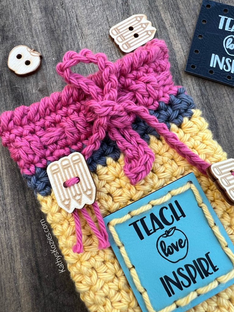 This crocheted pouch fits a 2 by 2 inch patch.